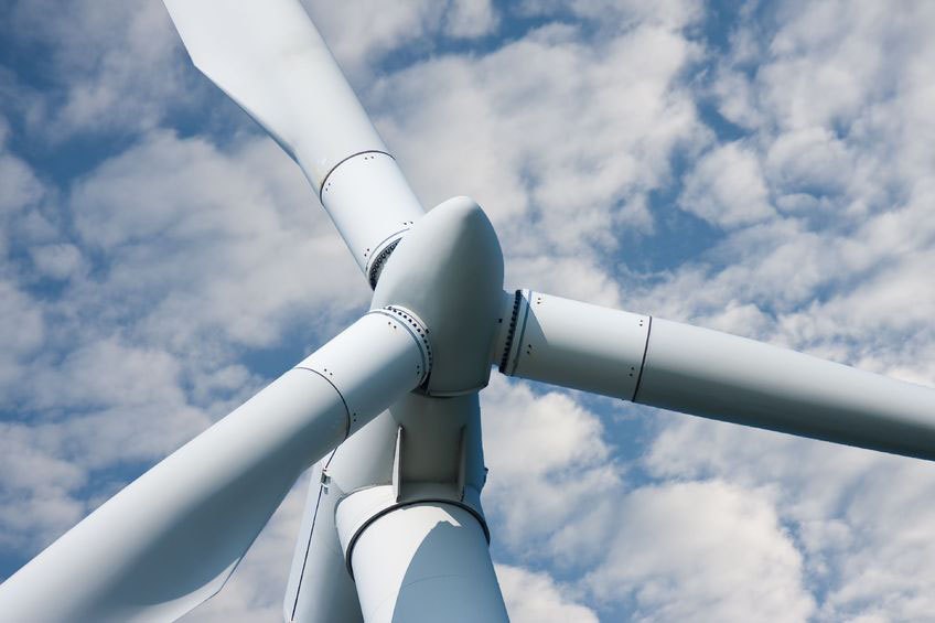 5867630 – closeup of a huge windmill against a cloudy sky