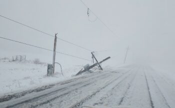 A power pole is shown snapped in half after the March 19, 2025, blizzard.