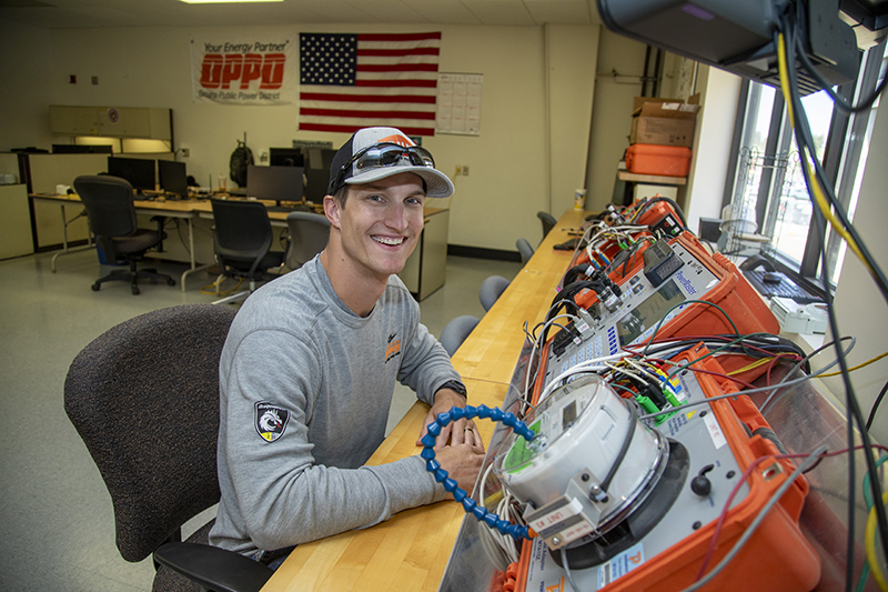 Caleb Peters tests one of the new smart meters that OPPD will soon begin using.