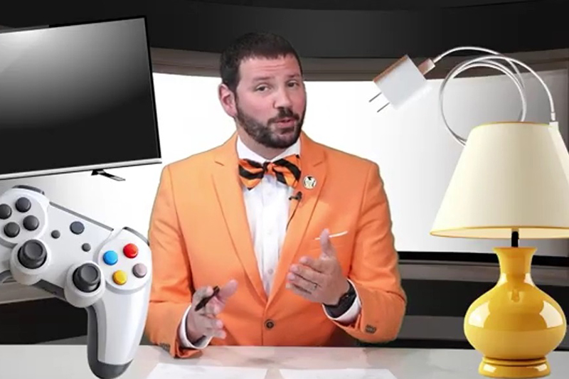 Energy Adviser Eric BenSalah is shown in the studio surrounded by photos of devices that use electricity: a lamp, phone charger, video game control and TV.