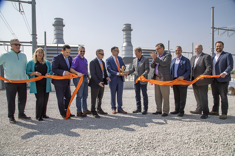 OPPD officials and others celebrate the Turtle Creek Station ribbon-cutting.