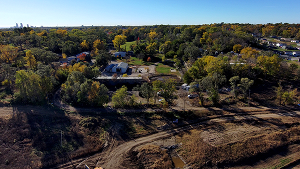 Crews worked to clear trees from this area, shown before the work happened.