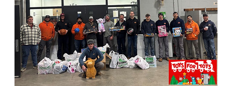 OPPD employees pose at Papillion Service Center with some of the toys collected for Toys for Tots.