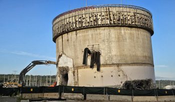 In this photo, the containment structure is shorter, as crews work to remove layers from the bottom.