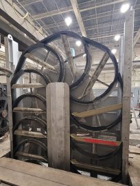 The new system operates as a sort of oval-shaped Ferris wheel. A roller chain pulls a rotating line of buckets through the water. The buckets, with a mesh-screen backing, scoop up fish as they enter the water-intake area, then carry them upward and release them into a water slide that carries them back to the Missouri River.