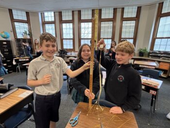 The By 100 Milliseconds team shows off the third=place tower.