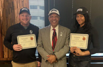 Alex Prine and Olivia Borsutzki hold certificates they received from Omaha Mayor John Ewing, center, and the City of Omaha.