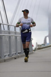 Dustin Marvel runs across a bridge during the triathlon.