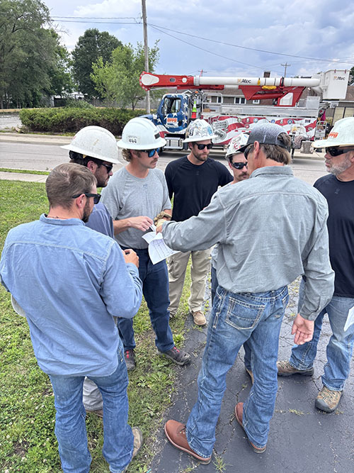 Members of OPPD's mutual aid team gather in a circle to talk.