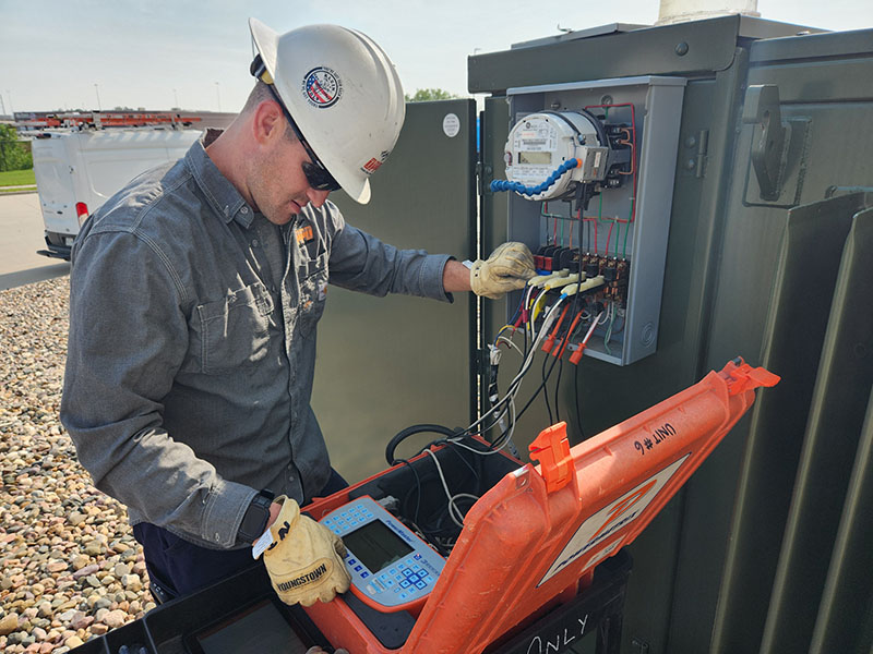 Nate Thies tests a meter to ensure it is performing accurately.